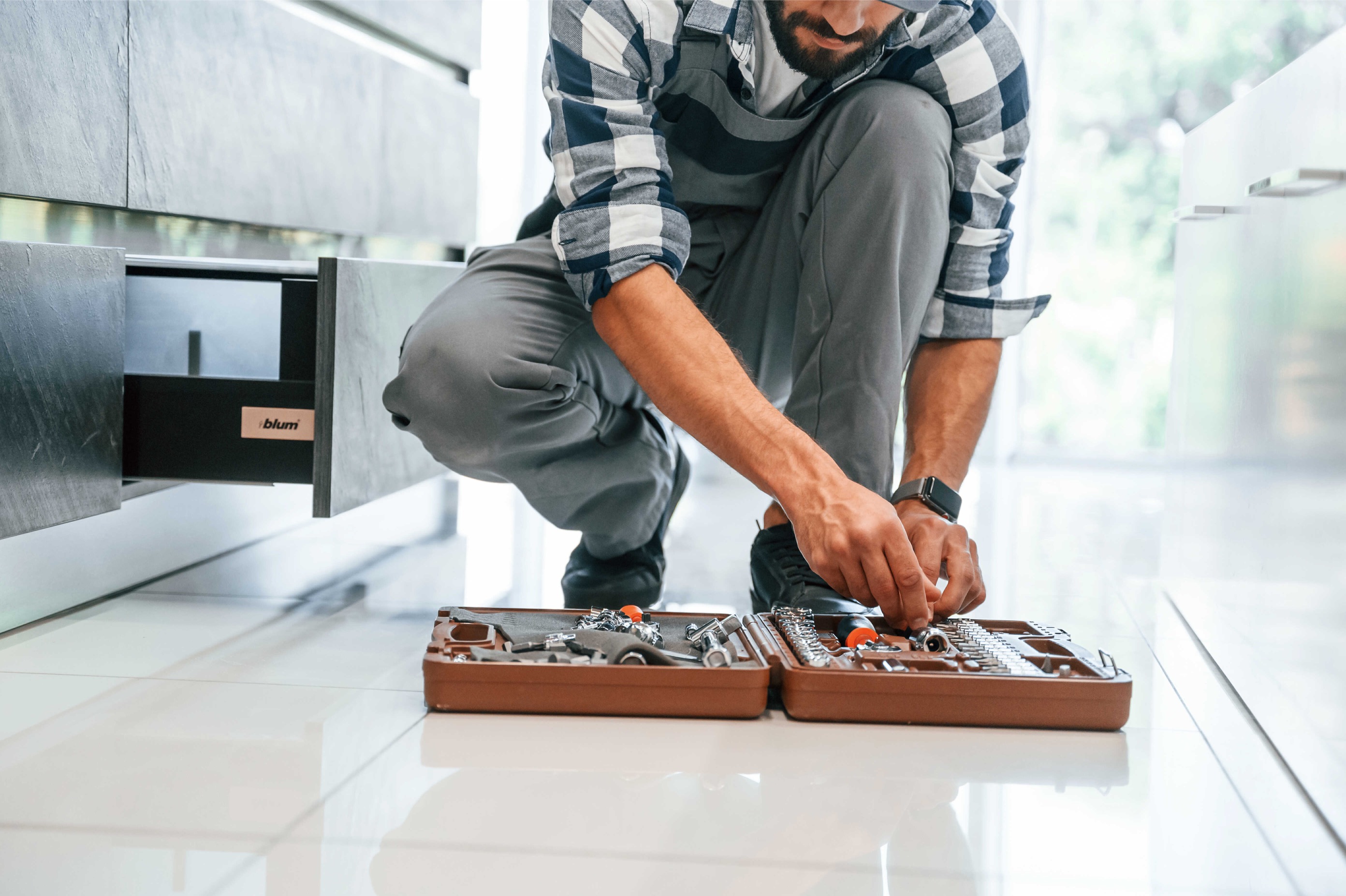 Professional plumber with tools and equipment